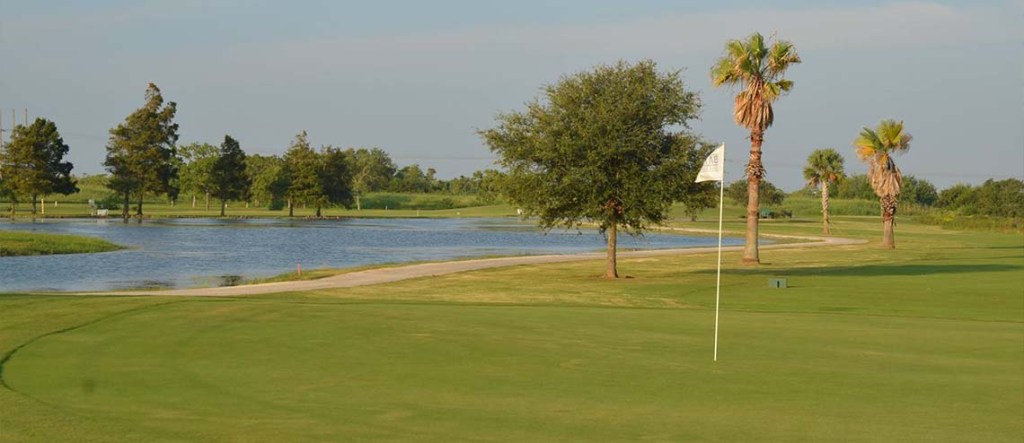 View of flag on golf course green